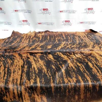 14	

Large Brazilian Brindle hair on cowhide rug. Measures approximately 38-46 square feet.
Large Brazilian Brindle hair on cowhide rug....