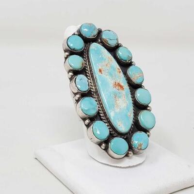 1116	

Statement Piece Native American Sterling Silver Ring With Turquoise Stones Marked G.James, 35.6g
One of A Kind Hand, Made Ring,...