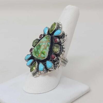 1226	

Native American Feeney Turquoise and Semi- Precious Stone Cluster Sterling Silver Ring, 14.4g
Weighs Approx. 14.6g Measures...