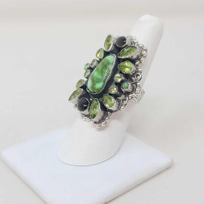 1224	

Native American Feeney Turquoise and Semi- Precious Stone Cluster Sterling Silver Ring, 14.4g
Weighs Approx. 14.4g Measures...