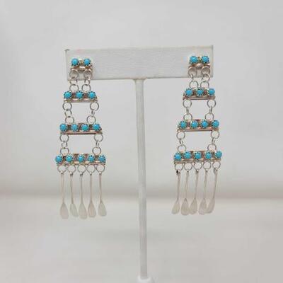 1192	

Pair of Native American Zuni Turquoise Sterling Silver, 7.8g
Weighs Approx. 7.8
Measures Approx. 1" Ã— 2.8 "
ZUNI...