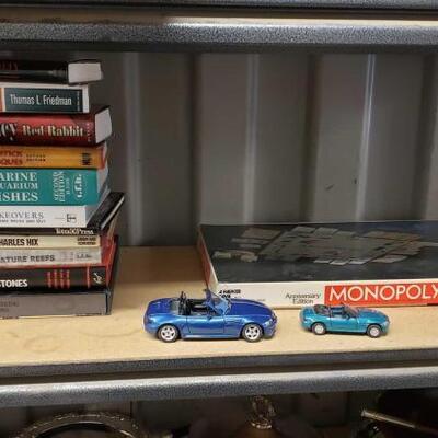 7554	

Toy Cars, Monopoly, And 11 Books
Toy Cars, Monopoly, And 11 Books