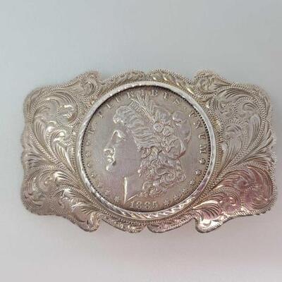 1252	

Sterling Silver Belt Buckle with Morgan Silver Dollar, 56.4g
Weighs Approx. 56.4g Measures Approx. 3"Ã—2" MORGAN SMITH...