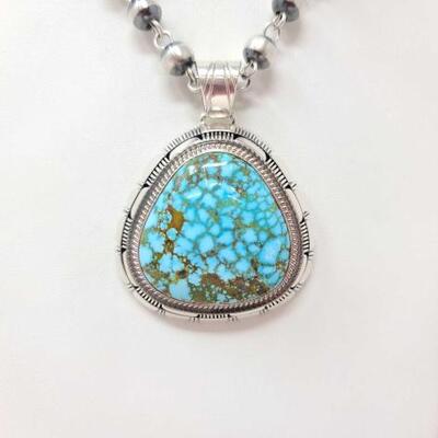 1188	

G. Nelson Red Webb Kingman Turquoise Sterling Silver, 60.96
Weighs approx. 60.9g
Measures approx. 2" Ã— 2.5"
G. NELSON...
