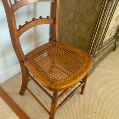 Antique Cane Chair

20 century care but homed chair. Simple chair treats great pretense in a small room
