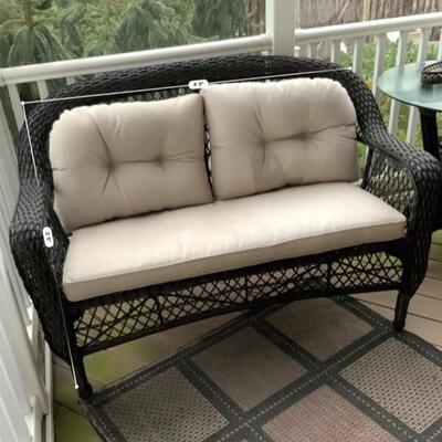 4 piece espresso wicker set with beige cushions.

2 x love-seats, side table and with outdoor carpet

