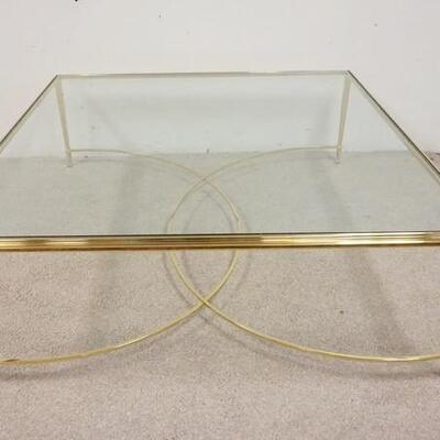 1025	BRASS GLASS TOP COFFEE TABLE, TOP IS BEVELED, 48 IN SQUARE X 17 1/2 IN HIGH
