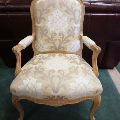 1027	FLORAL CARVED UPHOLSTERED ARM CHAIR
