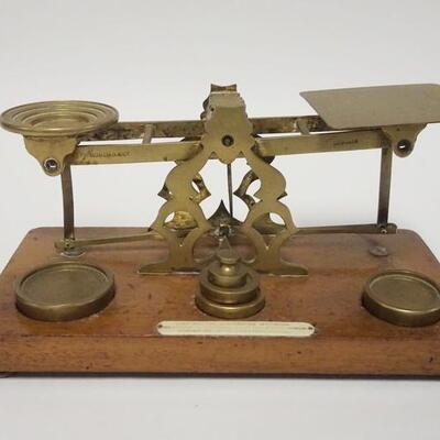 1009	POSTAL SCALE W/WEIGHTS, HAS CELLULOID LABEL, BASE IS 10 1/2 IN X 5 1/2 IN
