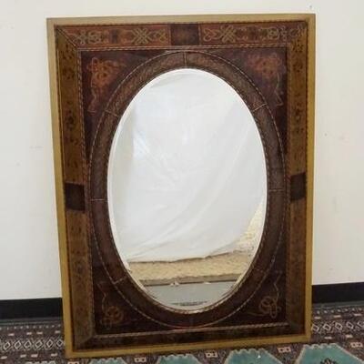 1035	ORNATE REVERSE GLASS DECORATED PANNELED FRAME WITH OVAL BEVELLED MIRROR, 36 IN X 48 IN
