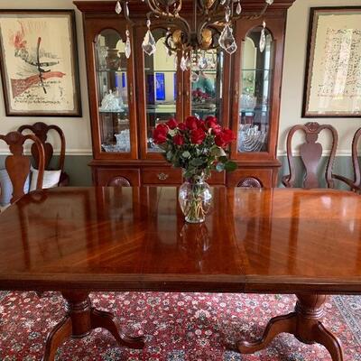 Elegant cherry table and China hutch.