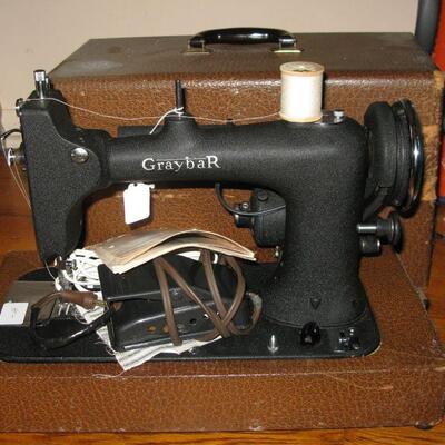 Gray Bar working sewing machine