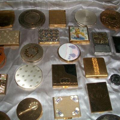 Large collection of vintage compacts.
