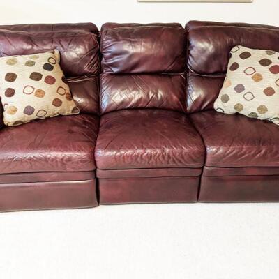 Burdundy leather dual reclining sofa