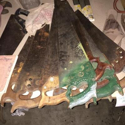 Several vintage hand saws