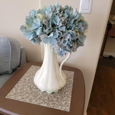 Retro vase with artificial flowers