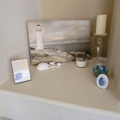 Lighthouse painting, crystal candle holder and seashells