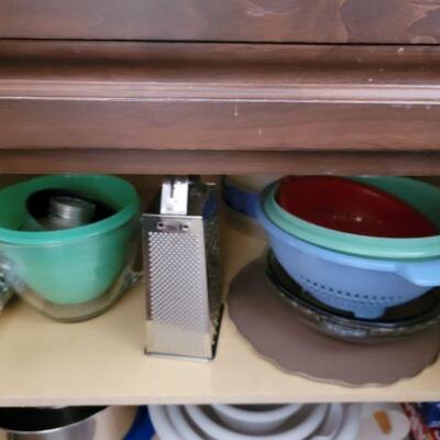 Mixing bowls colanders and cheese grater