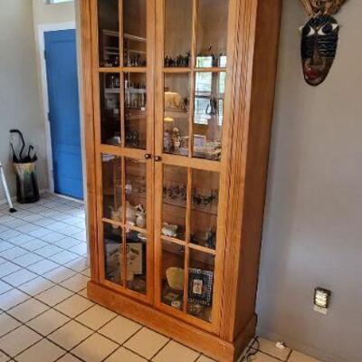 Tall wooden display cabinet