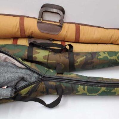 
#8152 â€¢ 3 Rifle Csses With Socks and Wooden Stocks