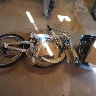 #4520 â€¢ New Xtreme Folding Ride Mt7 Bike and Tote of Bike Parts