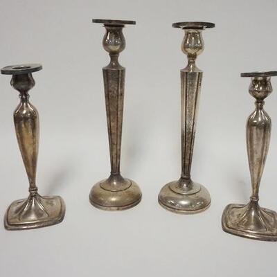 1032	2 PAIRS OF WEIGHTED STERLING SILVER CANDLESTICKS. TALLEST IS 10 IN 
