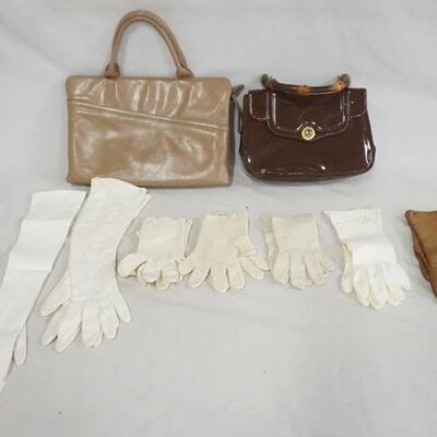 1271	LOT OF 2 PURSES & 7 PAIRS OF VINTAGE LADIES GLOVES. ONE OF THE PURSES IS SIGNED RUTH SALTZ. VARYING DEGREES OF WEAR AS FOUND. 

