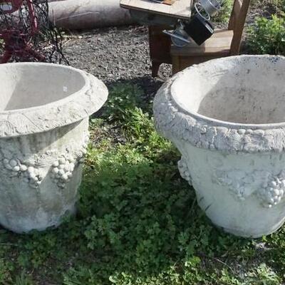 1200	2 LARGE CONCRETE PLANTERS W/GRAPE CLUSTERS
