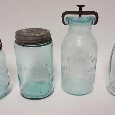 1033	4 CANNING JARS INCLUDING MILLSVILLE ATMOSPHERE, FRUIT JAR, SILICON & TWO MASON. TALLEST IS 9 1/2 IN 
