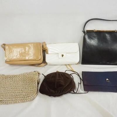 1240	LOT OF FIVE PURSES. LOT INLCUDES; WICKA WEAVE, JANA, & GHERANDINI. VARYING DEGREES OF WEAR. AS FOUND. 
