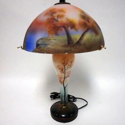 1025	CONTEMPORARY PAINTED GLASS LAMP, HAS SOME MINOR PAINT LOSS ALONG THE SHADE RIM
