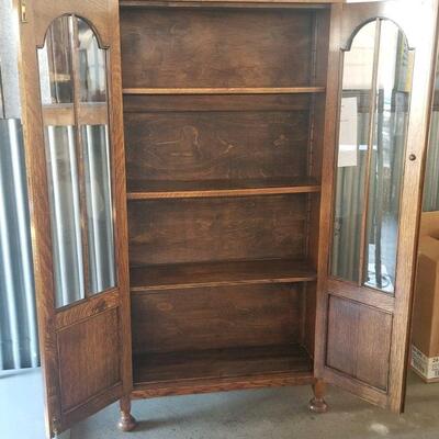 Two top shelves are moveable, lowest shelf is not, no key but lock is intact if you want to have one made.