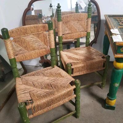 Set of four vintage rush seat, wood chairs from Mexico. Two have taller finials in excellent condition for their age!