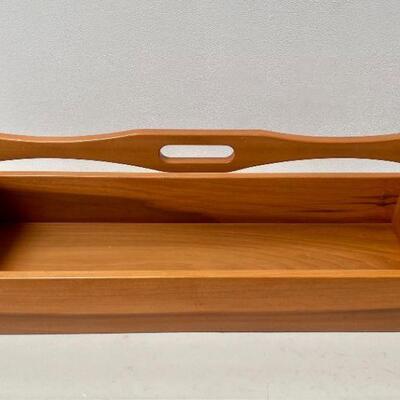 Solid wood carry all. Has felt on the bottom