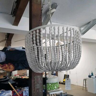 Closer view of wood beaded hanging lamp; only used as a set design piece, excellent working condition