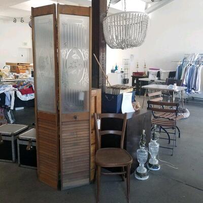 We have this vintage wood and etched glass divider and the white wood bead hanging lamp (both from the prop house that furnish major Tv...