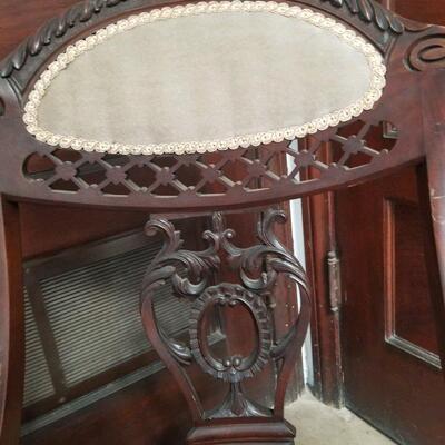 Detail on Antique mahogany slipper chair