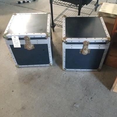 Two vintage matching wood storage trunks with metal seams and hatches. These make great end tables!!!