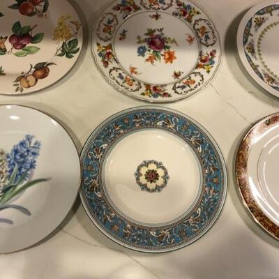 Tons of mix and match China dinner plates, salad plates and bread dishes make for an eclectic dining table setting.