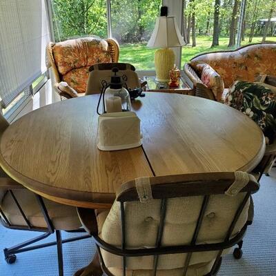 Oak pedestal dining table/4 swivel chairs
