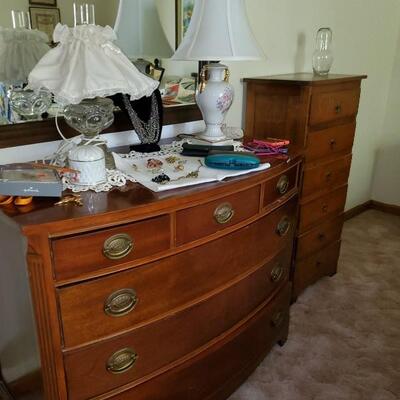 Mahogany dresser with curved front, lingerie chest, lamps, mirror