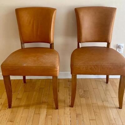 Two Leather Upholstered Side Chairs. 50. Each