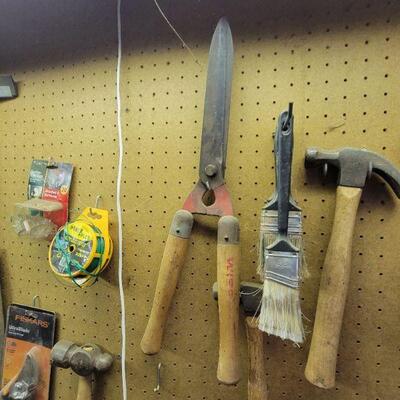 Gardening shears paint brushes and hammer