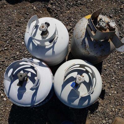 50032	

Four Propane Tanks
Surrounding Items Not Included!!
