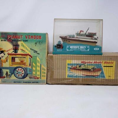 3070	

Vintage Battery Operated Toys
The Jolly Peanut Vendor. Motorific Boats Automatic Bailer & Wooden Model Boat