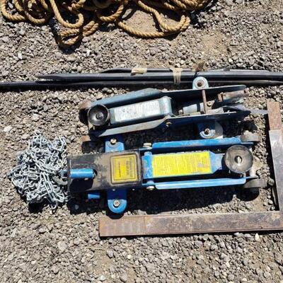 #50052 â€¢ Two Car Jacks, Three Crowbars, Metal Rulers, One Chain