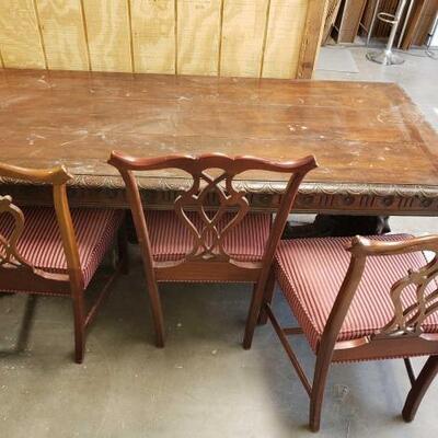 2002	

Wooden Table And Three Chairs
Table Measures Approximately: 83"Ã—36"Ã—30" Chairs Measure Approximately:...