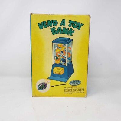 3060	

Vintage Toy
Vintage "Vend A Toy Bank"