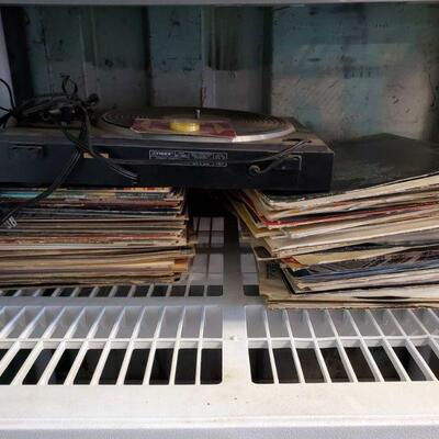 3110	

Record Player And Records
Includes Queen, Van Halen, Aerosmith, The Beatles, John Lennon, And More