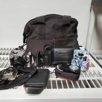 
#2330 â€¢ 8 Viewcam Video Camera, Canon Camera, Hero 2, And More